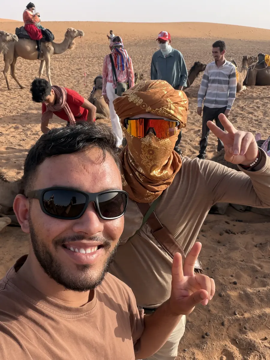 Camel caravan in Merzouga Our Morocco Zaino guide with travellers in the Sahara